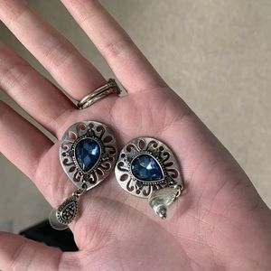 Silver teardrop earrings with blue stone center
